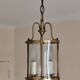 Cylindrical brass and glass lantern in Louis XVI style.