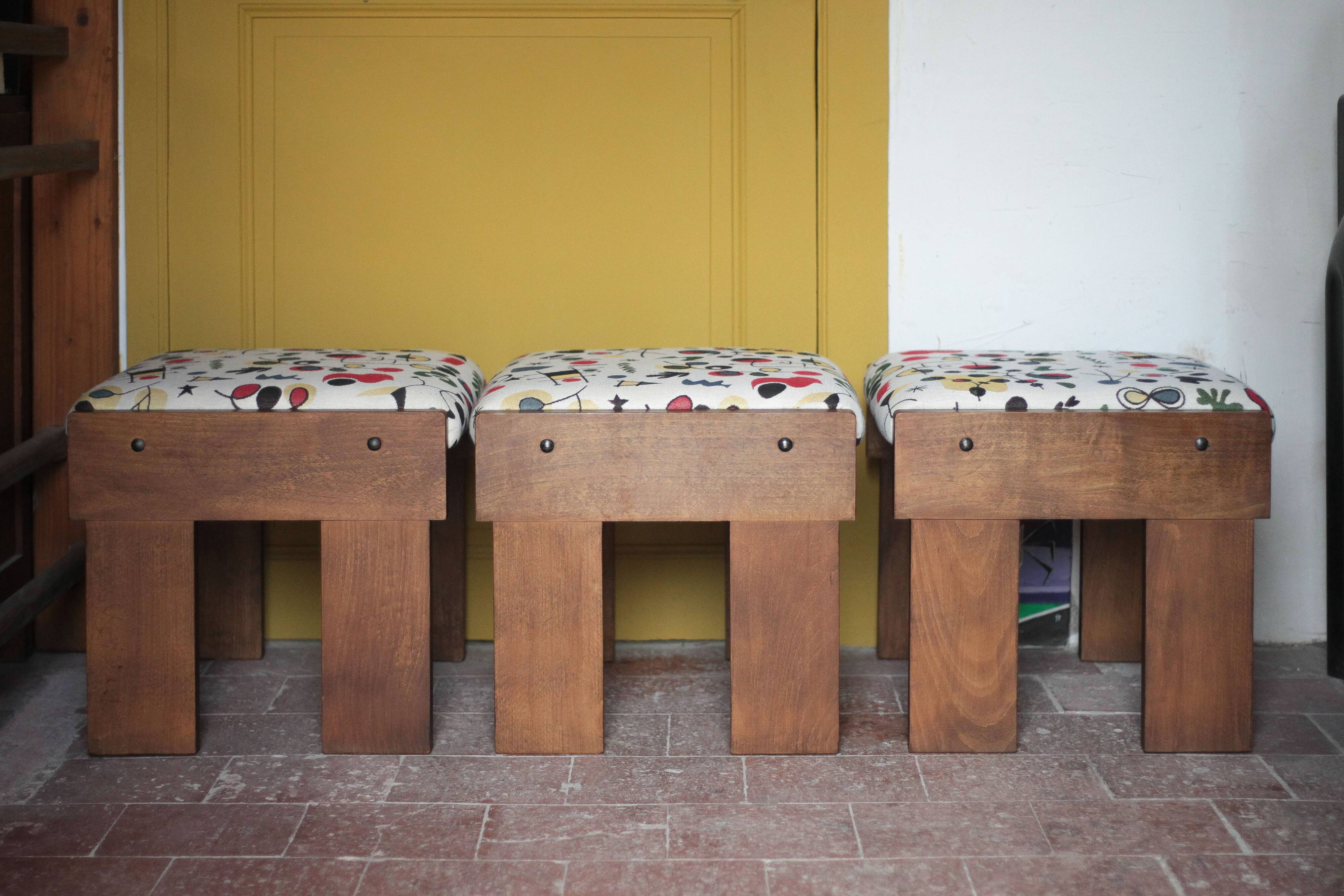 Set of 3 beech wood stools with fabric upholstery in the style of Miro.