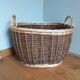 Very large oval laundry basket in two-tone braided wicker with handles