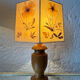 Turned wood lamp with a herbarium lampshade from the 1970s.
