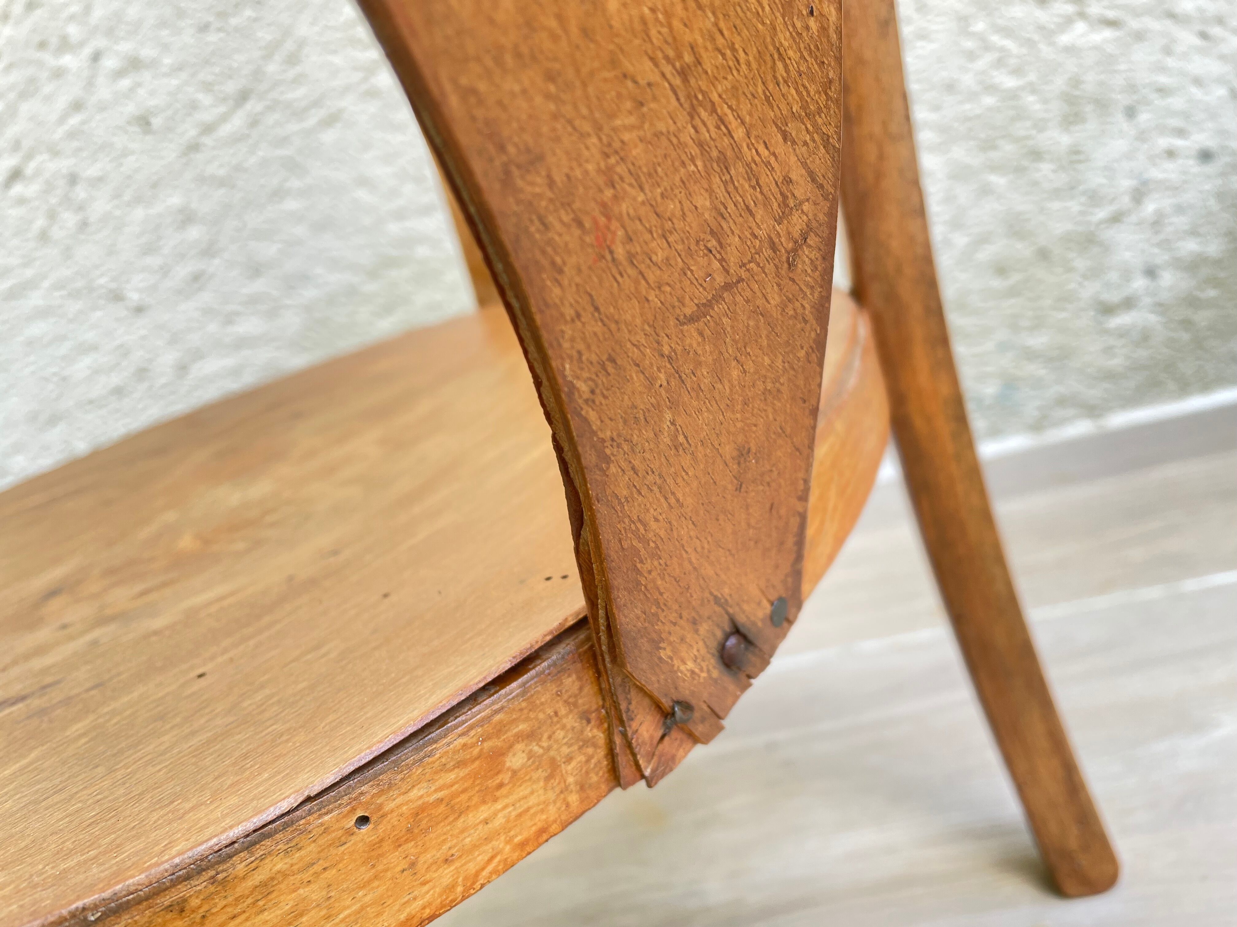 Old armchair for children in wood