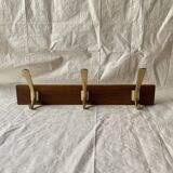 Vintage wooden wall-mounted coat rack with 3 golden cast aluminum hooks