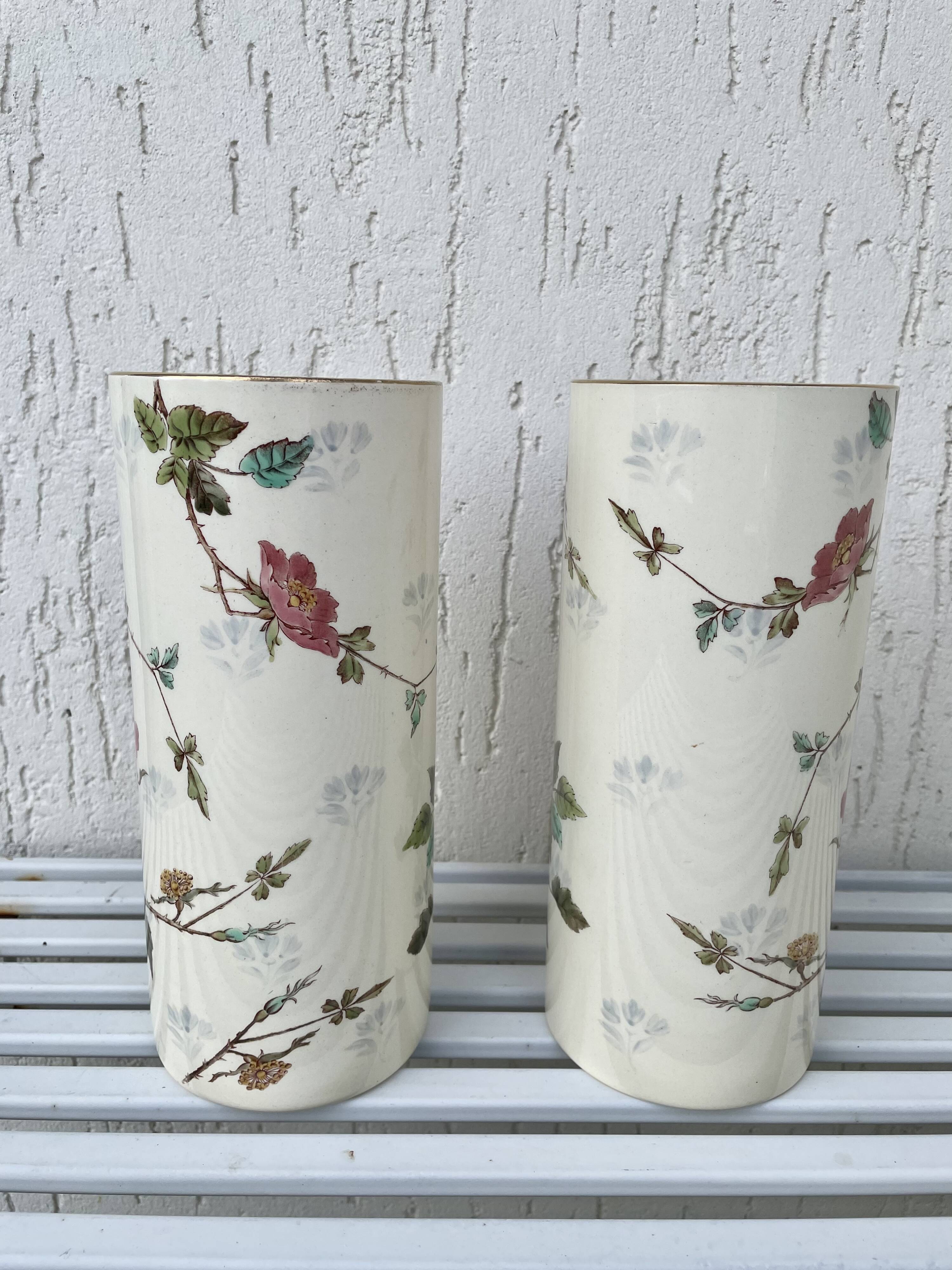 Roller vases in earthenware with floral decoration of wild rose, circa 1930–1950.