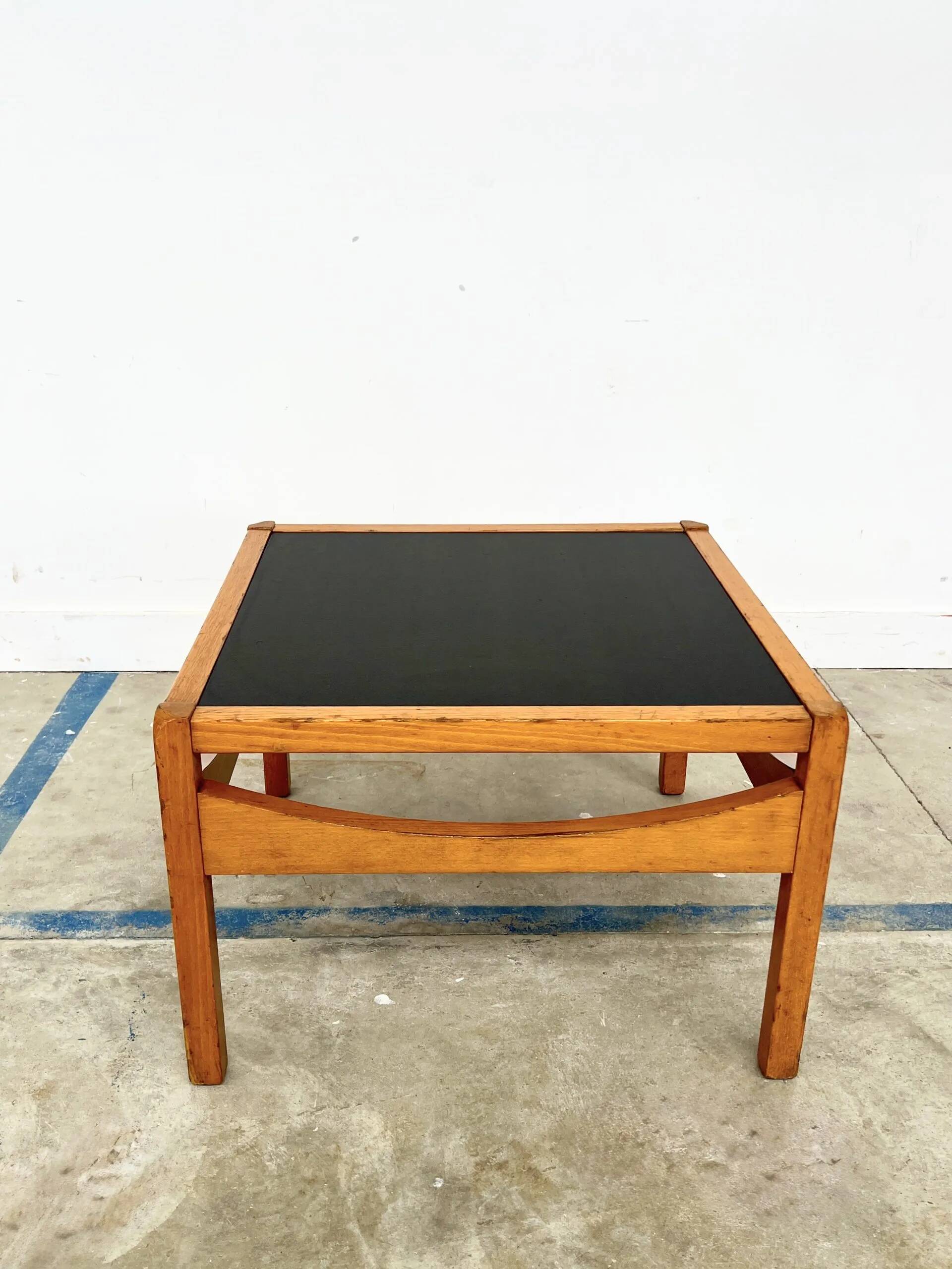 Baumann coffee table with black medium-density top