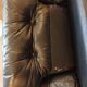 Pair of designer leather armchairs by Tobia Scarpa.