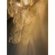 A pair of transparent “ricci” murano glass wall sconces