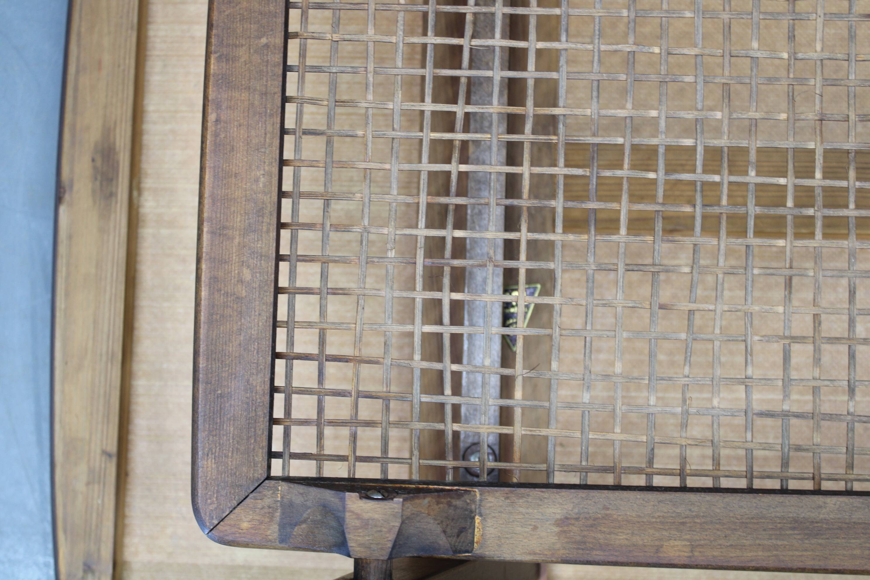 Mid-century German coffee table with rattan shelf and brass legs