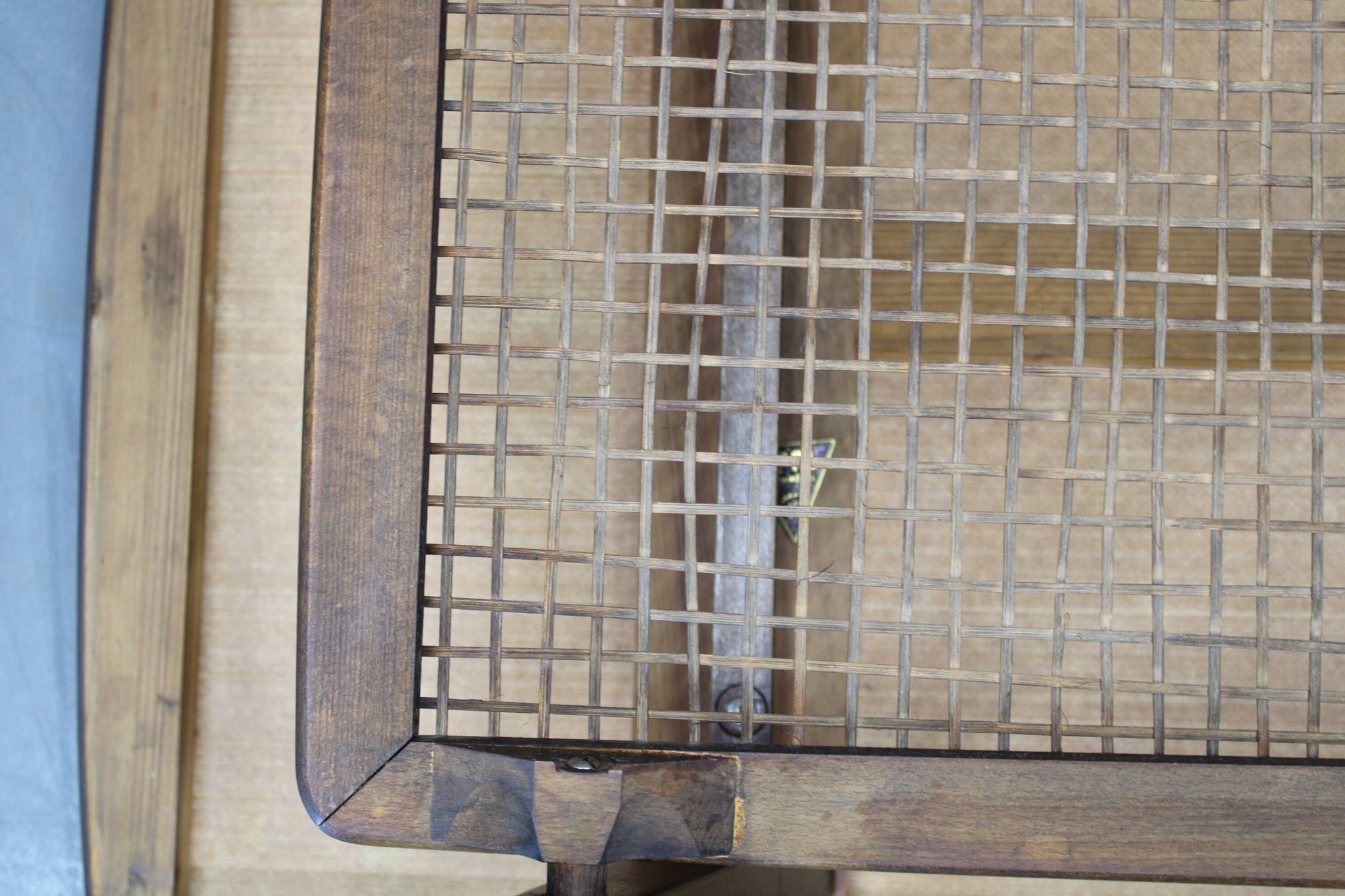 Mid-century German coffee table with rattan shelf and brass legs