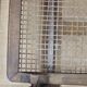 Mid-century German coffee table with rattan shelf and brass legs