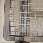 Mid-century German coffee table with rattan shelf and brass legs