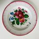 Eastern earthenware plate from the mid-19th century with a hollow rose design.