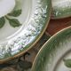 7 earthenware dessert plates with apple decoration and slip-brushed rim, KG Lunéville