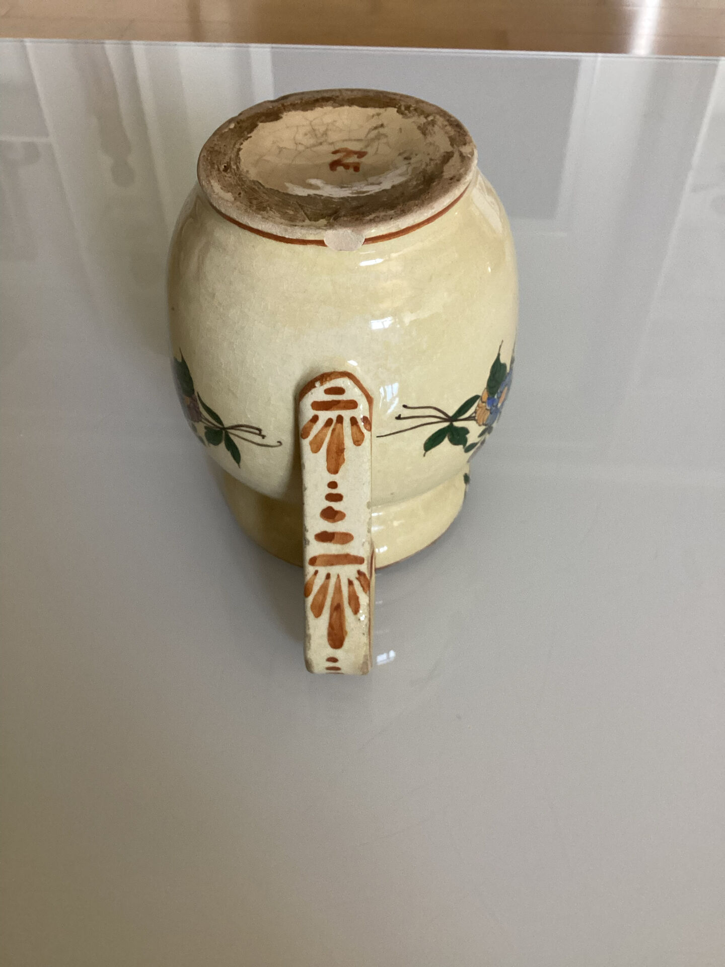 Old ceramic jug with floral decoration