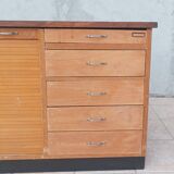 Workshop furniture with drawers and curtain in beech and walnut.