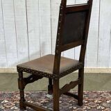 High-backed chair from the early 20th century in oak and leather