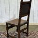 High-backed chair from the early 20th century in oak and leather