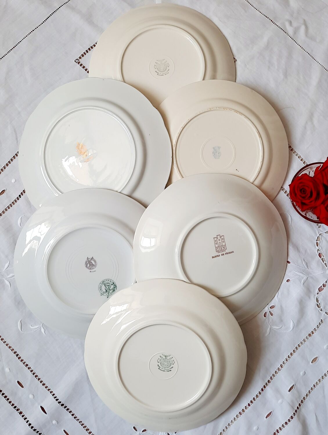 Flat antique earthenware plates with gilded edges