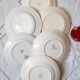 Flat antique earthenware plates with gilded edges