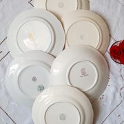 Flat antique earthenware plates with gilded edges