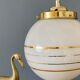 Suspension globe vintage art déco en opaline blanche et dorée