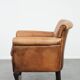 Vintage sheepskin armchair with a beautiful light colour and elegant legs