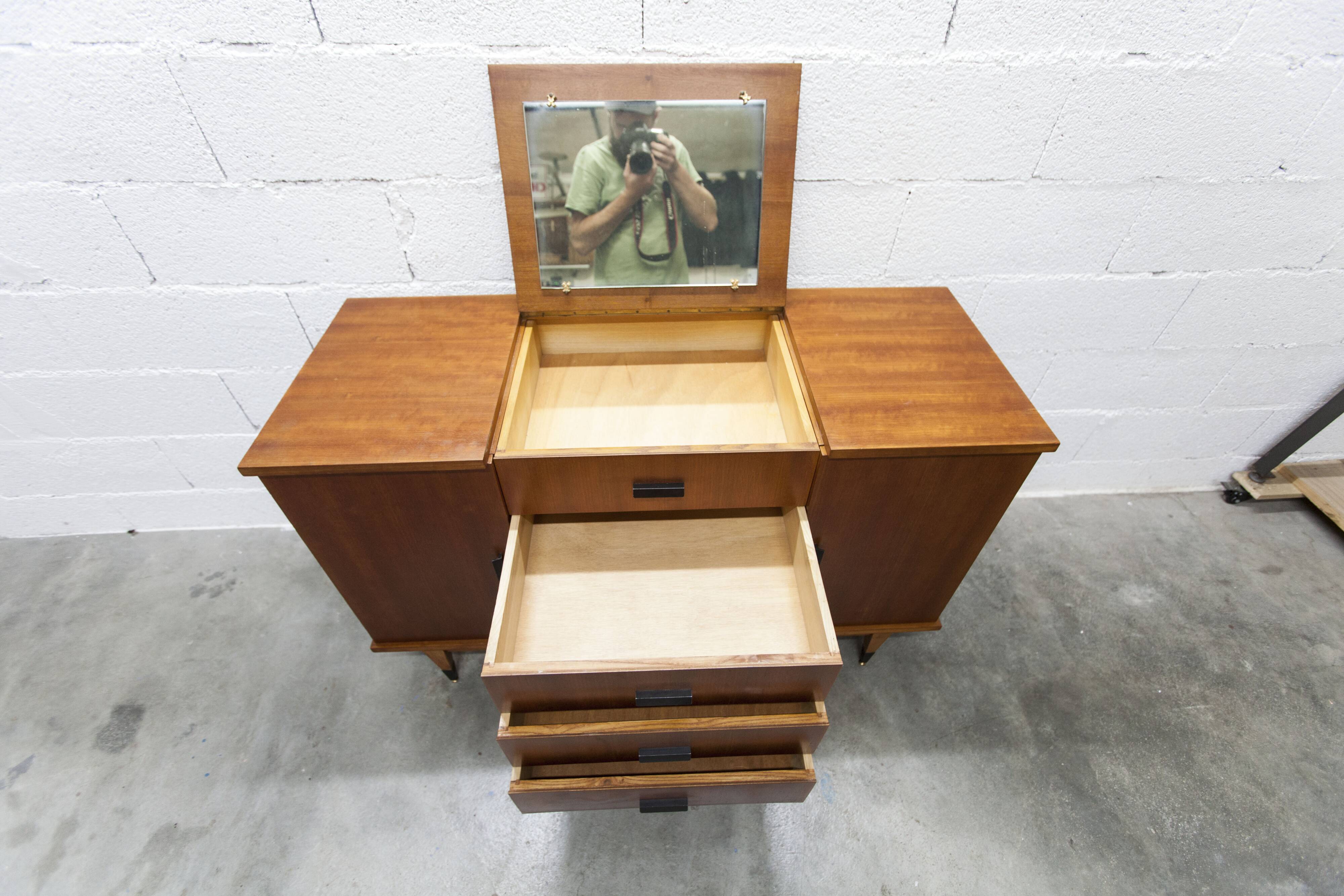 1960s teak sideboard with 4 drawers, 2 doors, and a mirror.