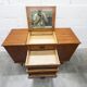 1960s teak sideboard with 4 drawers, 2 doors, and a mirror.