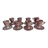 Coffee set with coffee pot, cups, and saucers.