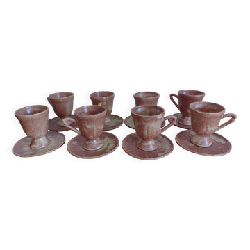 Coffee set with coffee pot, cups, and saucers.
