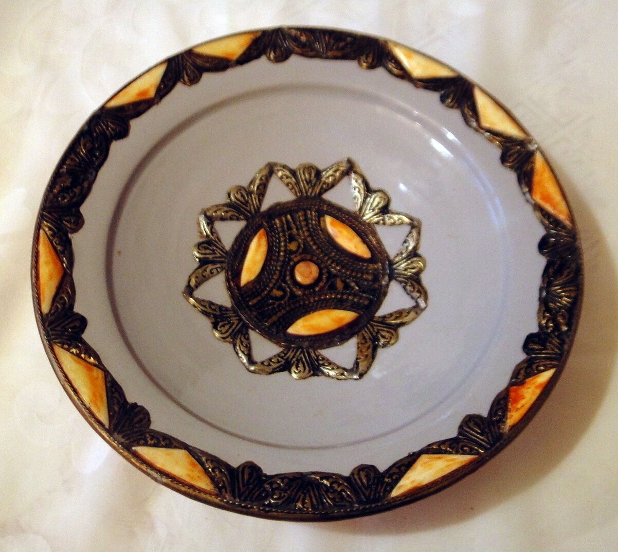 Hollow glazed terracotta dish with oriental decor to hang