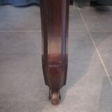 Half-moon mahogany game table on casters