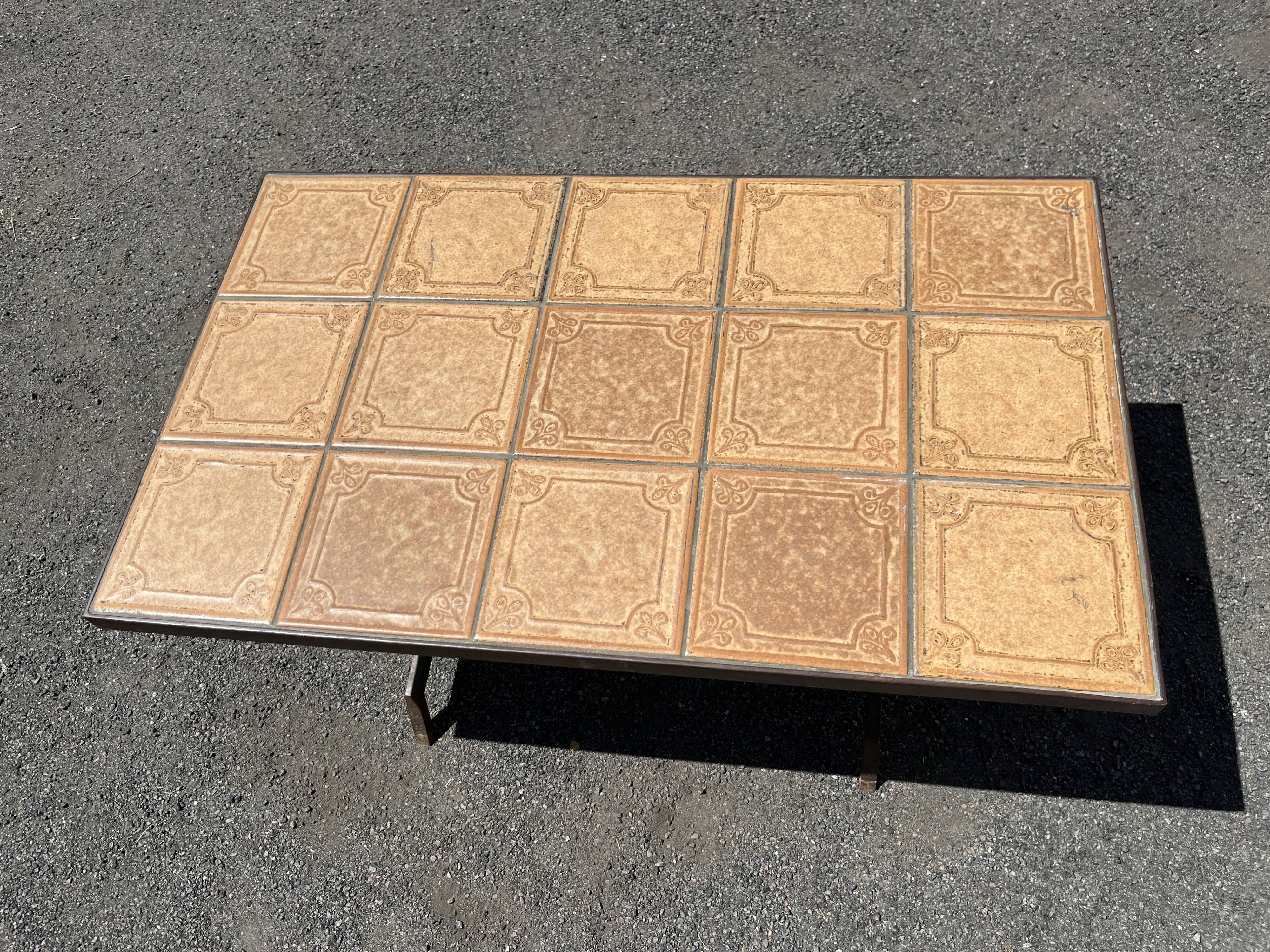 Vintage garden table with ceramic tile top and wrought iron base