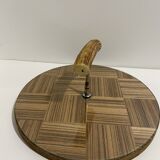 Vintage round wooden cheese board covered with glass plate with foldable handle