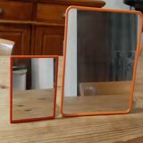 2 vintage plastic orange mirrors