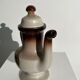 Vintage stoneware teapot with flower and fruit patterns