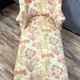 Chaise longue or rest bench Napoleon III era with floral fabric around 1850