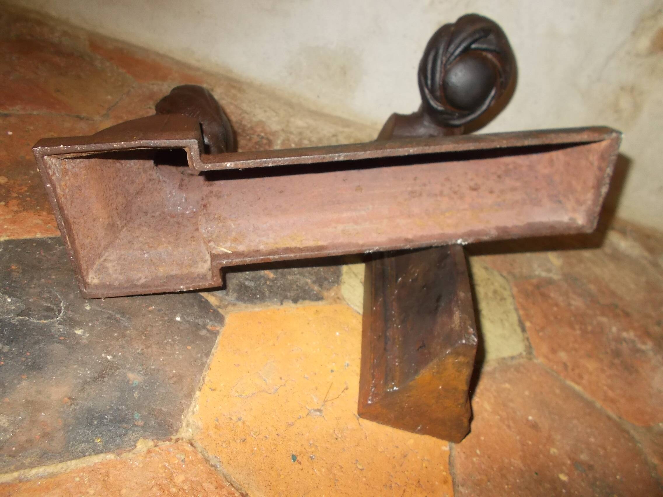 Old cast iron andirons with oriental decor