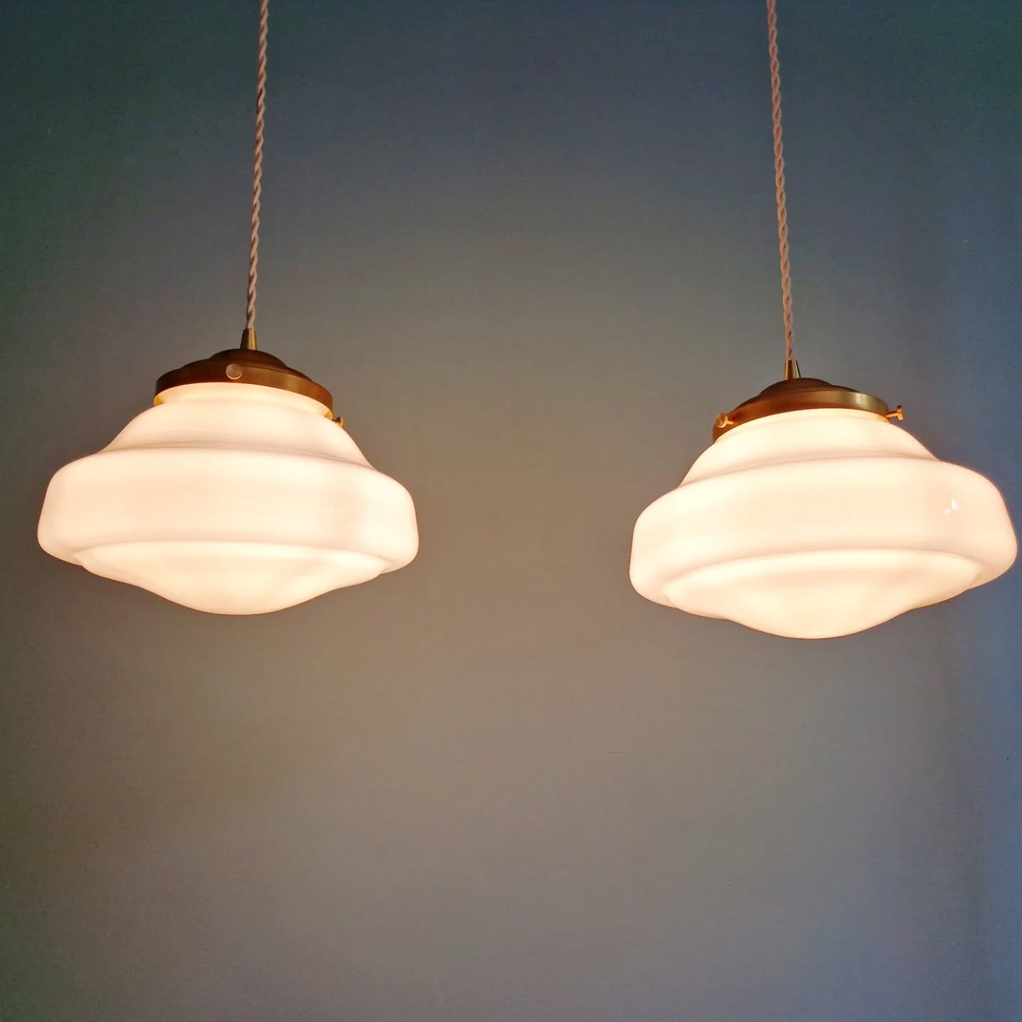 Pair of Art Deco pendant lights in white opaline.