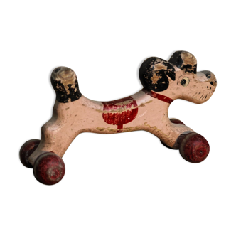 Wooden poodle with wheels, pink and red, flooring game to shoot