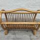 Magazine rack in braided rattan of the 60s