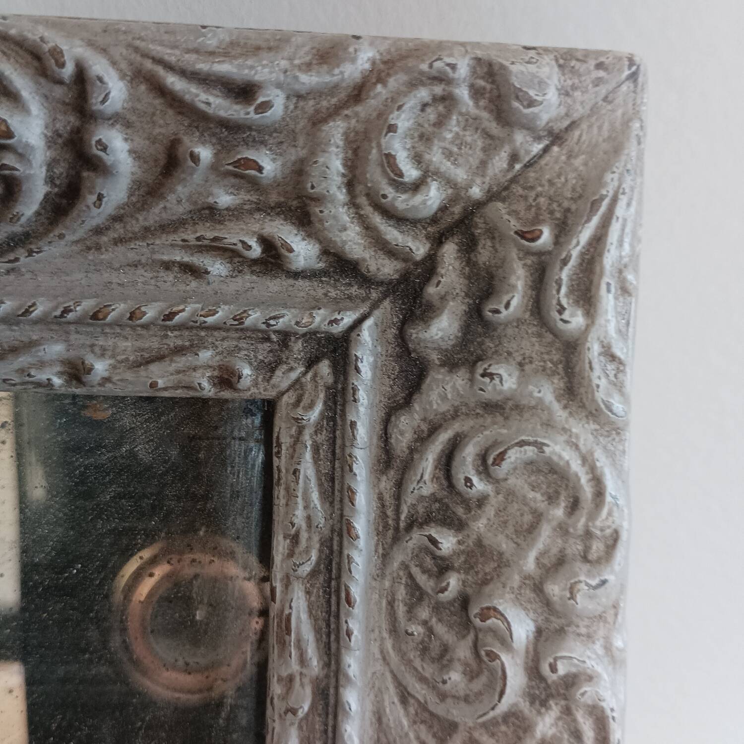 Antique mirror in carved, painted and patinated wood