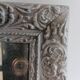 Antique mirror in carved, painted and patinated wood