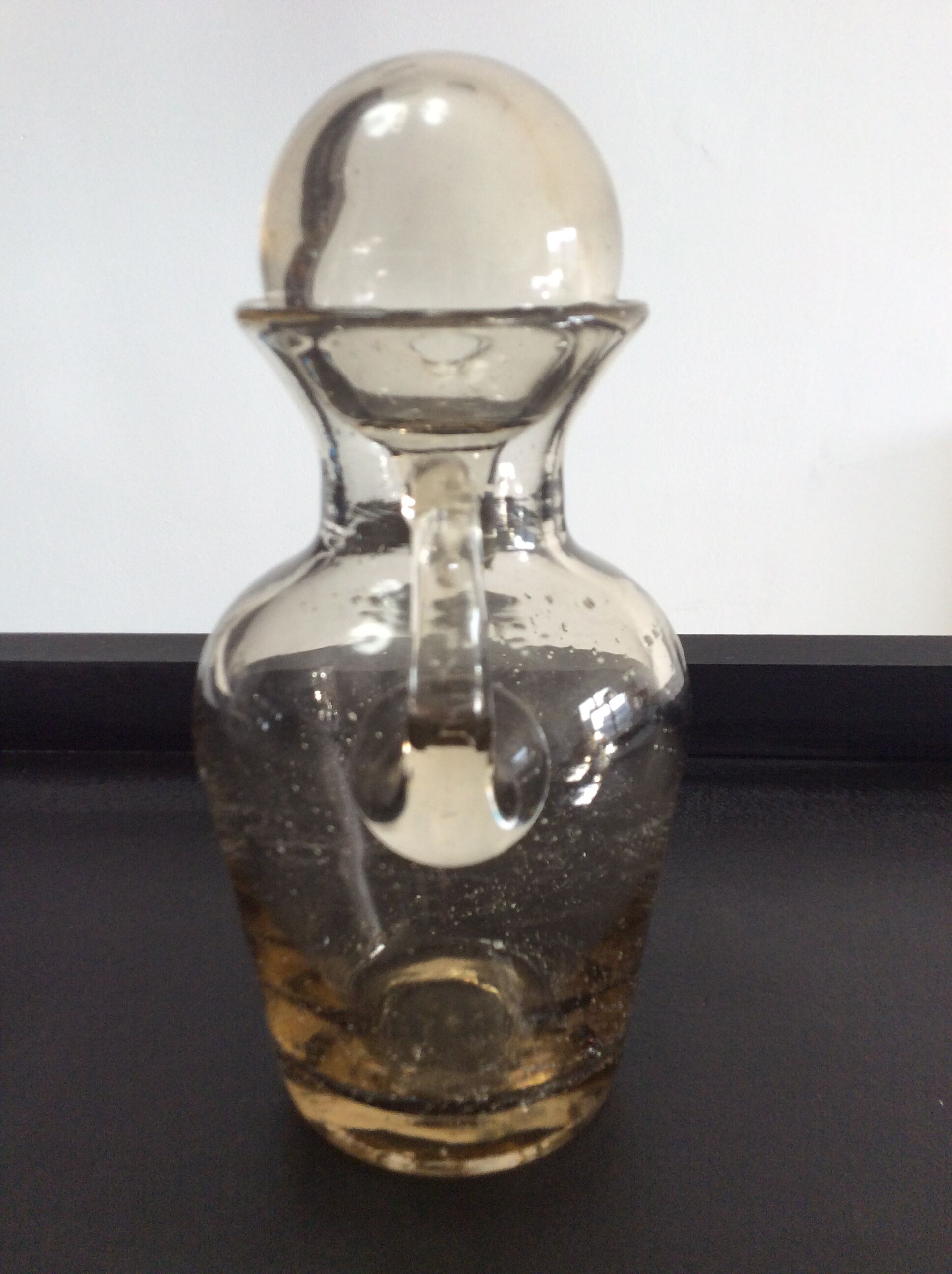 Vintage decanter made of blown glass paste