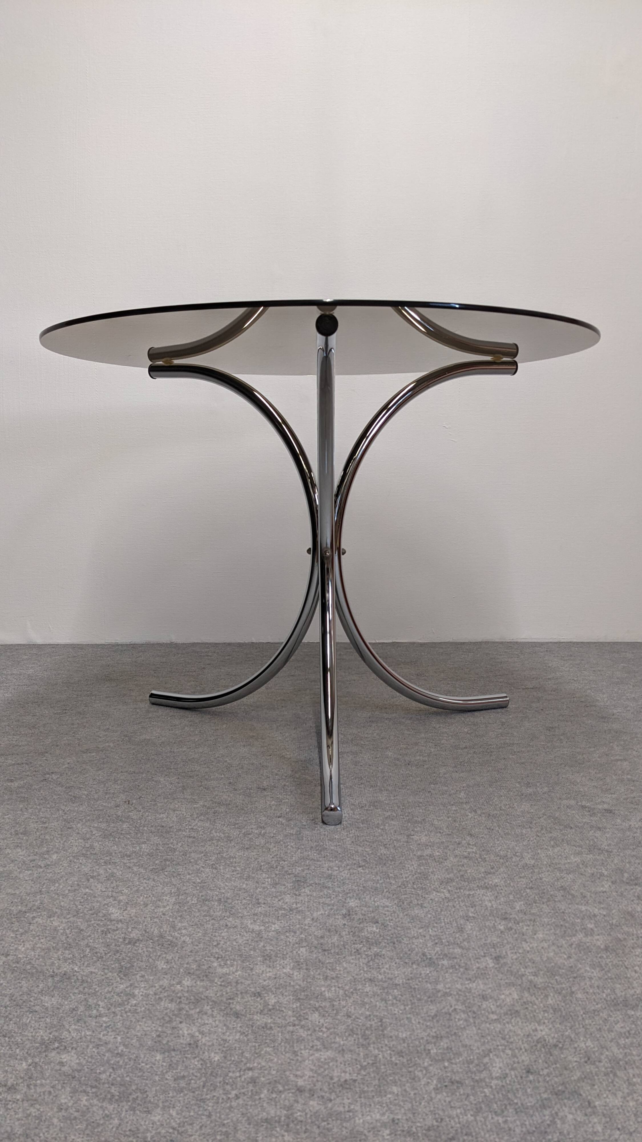Chrome metal and smoked glass round table, Italy circa 1970.