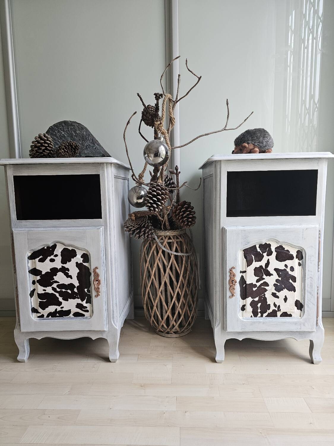 Two solid wood bedside tables with calfskin decoration.