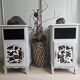 Two solid wood bedside tables with calfskin decoration.