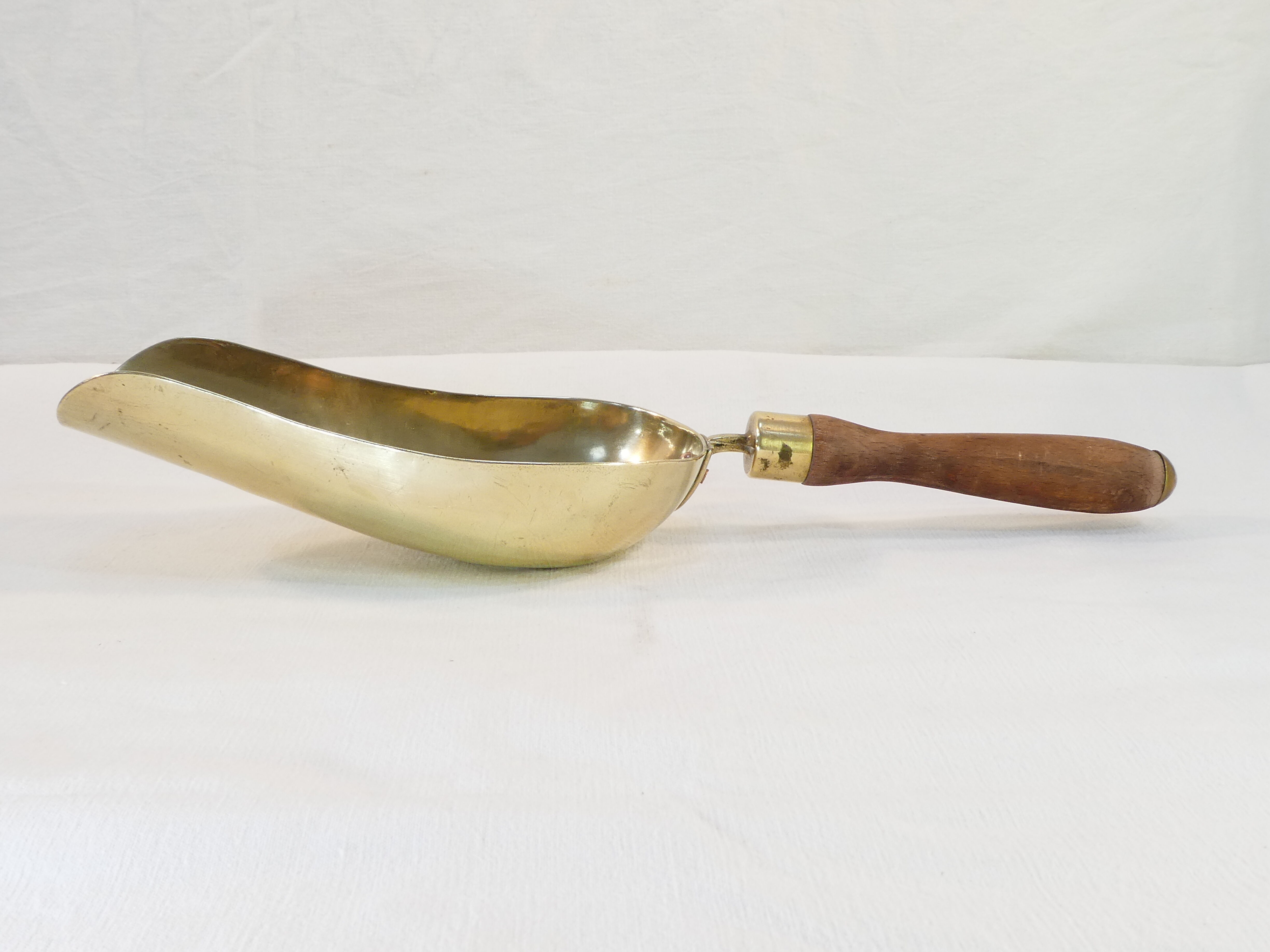 Old brass grocery grain shovel wooden handle
