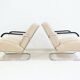 Pair of beige leather and tubular steel armchairs.