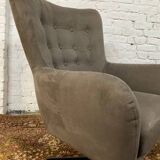 Swivel armchair in velvet fabric and metal