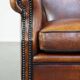 Sheepskin armchair/lounge chair finished with decorative nailheads